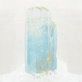 Close-up of Natural Raw Beryl Aquamarine Crystals against white background