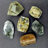 6 different Garden quartz druzy gemstones on dark background