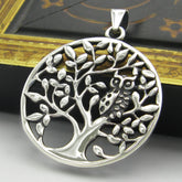Round sterling silver cut-out pendant with owl in tree design
