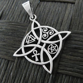 Front view of a silver witch's knot pendant with four symbols on a dark basket weave background