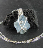 sky blue celestite pendant necklace silver plated wire wrapped protection healing stone celestine rock gem natural aqua rough gemstone front view