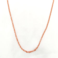 A copper rolo chain necklace displayed against a clean white background.
