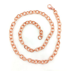 A heavy copper cable necklace with a lobster clasp, coiled on a plain white background.