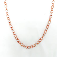 A copper chain necklace with elongated oval links, displayed against a plain white background.