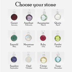 A jewelry selection chart titled 'Choose your stone' showing twelve round gemstone pendants arranged in a 3-by-4 grid on a light gray background. Each pendant is labeled with its corresponding month and gem name, including Garnet January, Amethyst February, Aquamarine March, Quartz April, Emerald May, Moonstone June, Ruby July, Peridot August, Sapphire September, Opal October, Citrine November, and Topaz December.