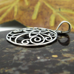 Side View of Silver Cut-out Pendant with Celtic Triquetra Knot Design