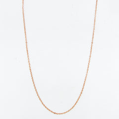 A copper cable chain arranged in the shape of a catenary arch with a white background.