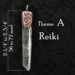 Pendant of clear quartz point with inscribed copper cap titled on dark background