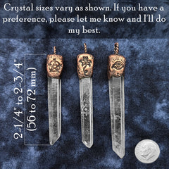 Three clear crystal point pendants with bronze-toned tops are displayed on a dark blue textured fabric background. White text at the top and left side shows size information, and a coin is shown at the bottom right for scale.