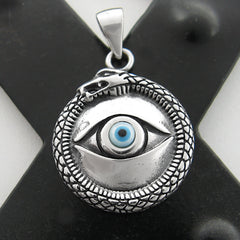 Front view of silver and blue evil eye pendant with snake border on a dark X background.