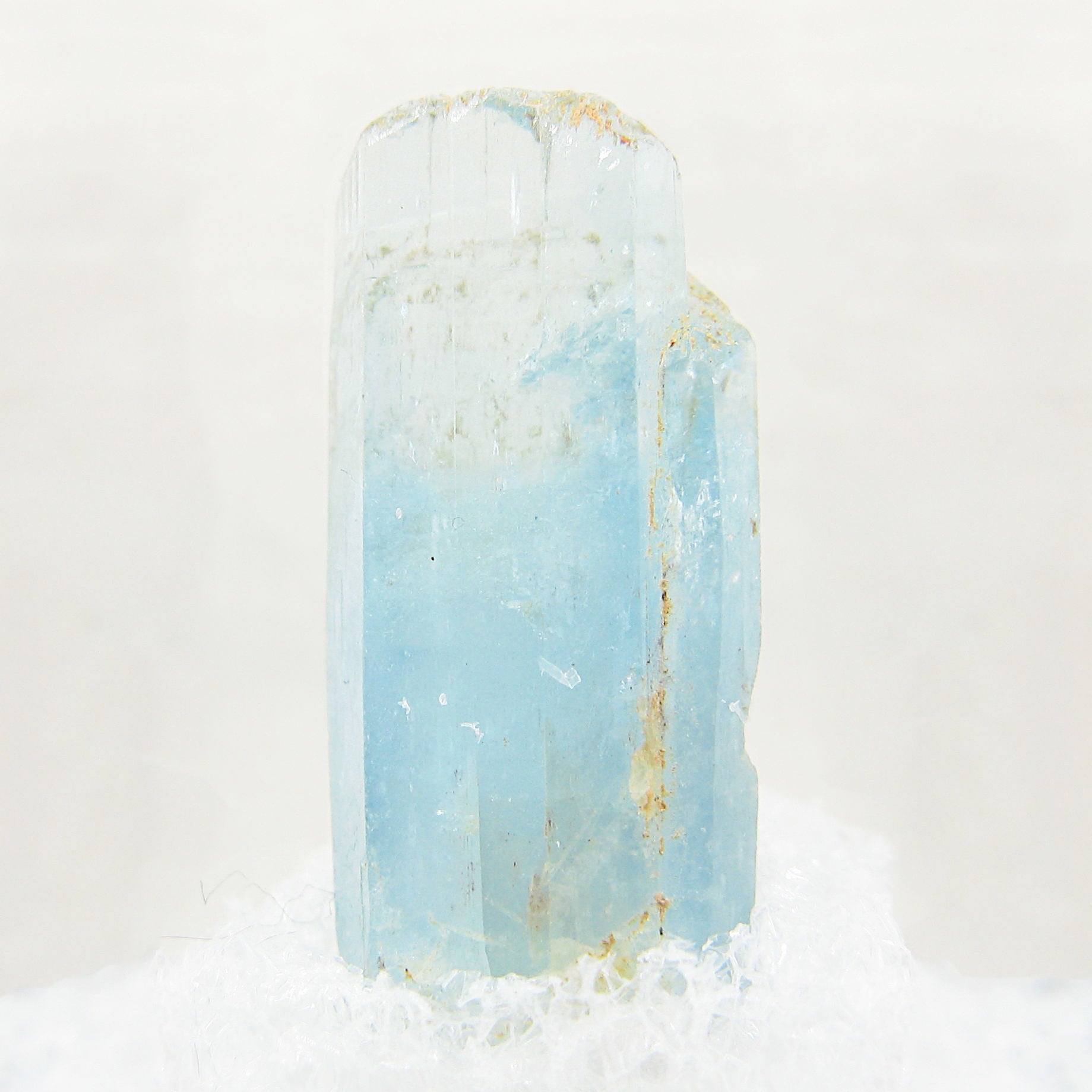 Close-up of Natural Raw Beryl Aquamarine Crystals against white background