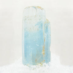 Close-up of Natural Raw Beryl Aquamarine Crystals against white background