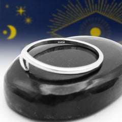 Side view of a silver ring with a sleek modern lightning bolt/thunderbolt symbol that is  minimalist