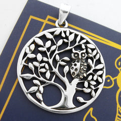 Round sterling silver cut-out pendant with owl in tree design