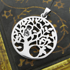 Reverse side of round sterling silver cut-out pendant with owl in tree design