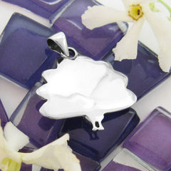 Smooth polished reflective backside reverse side of a sterling silver peacock animal pendant with feathers fanned out open.