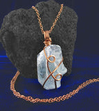 sky blue celestite pendant necklace copper wire wrapped protection healing stone celestine rock gem natural aqua rough gemstone witchy inner peace meditation relaxation goth gothic pagan witch mystical spiritual amulet talisman gemstone chakras yoga meditation spells mindfulness front view
