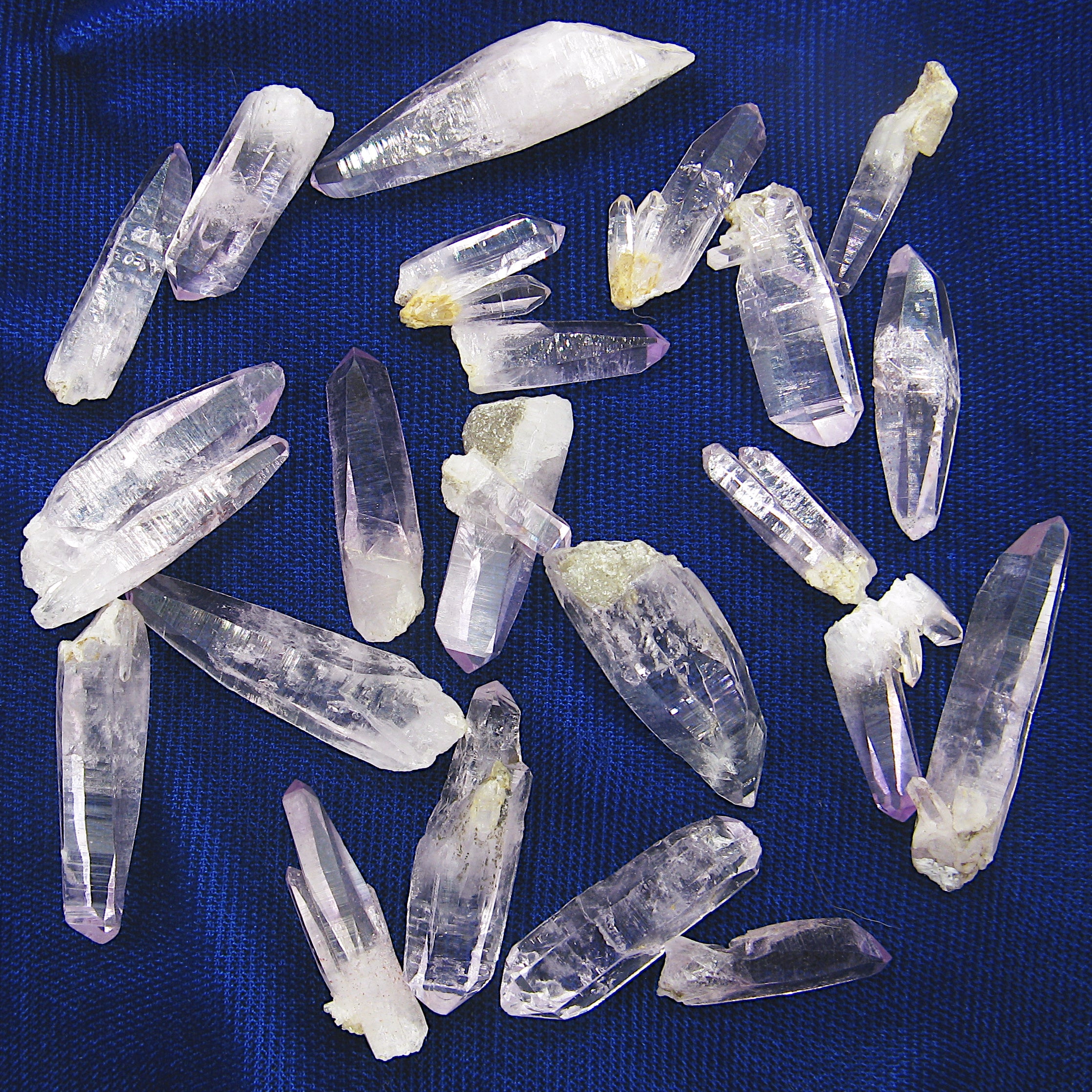 Different Veracruz Amethyst Crystals randomly arranged on dark background