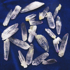 Different Veracruz Amethyst Crystals randomly arranged on dark background