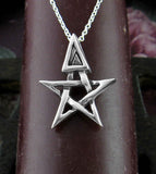 Tiny Wiccan Third Degree Pentagram Necklace High Priest Priestess Pentacle Witchcraft Witch Jewelry front view in front of a burgundy candle