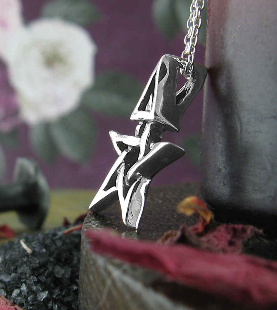 Tiny Wiccan Third Degree Pentagram Necklace High Priest Priestess Pentacle Witchcraft Witch Jewelry side view in front of white flowers