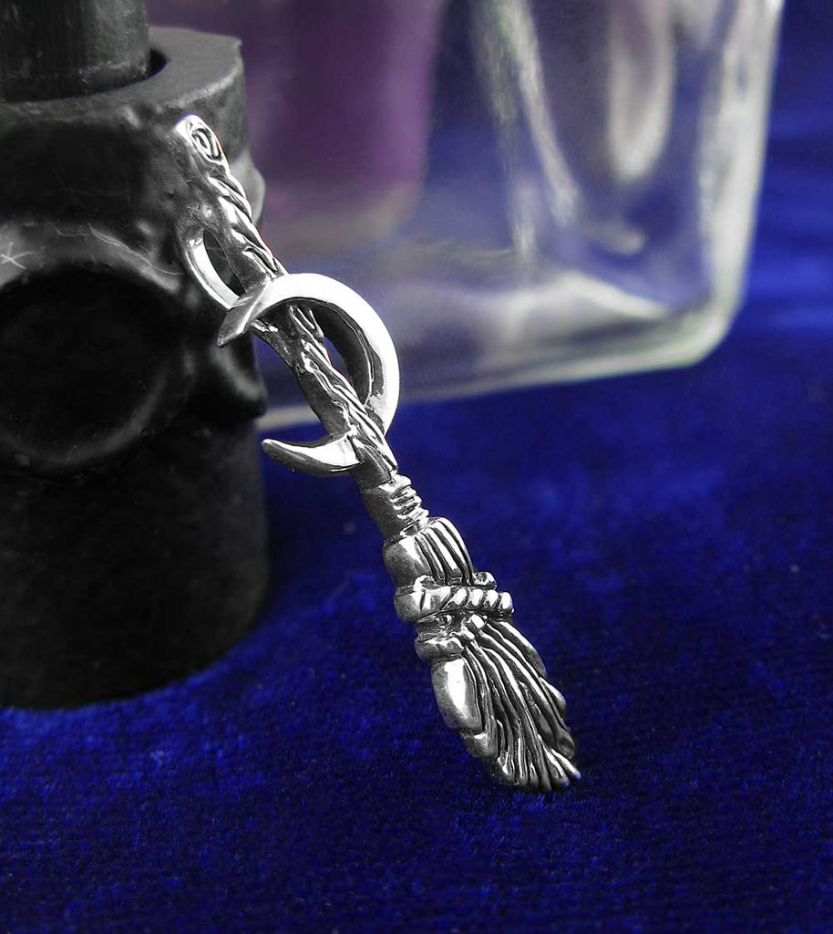 Witch's Broom or Besom w/ Crescent Moon Pendant Necklace Wiccan Wicca Pagan Witchcraft Silver Halloween Samhain Broomstick against deep blue background with glass jar 