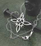 Witch Knot Necklace Pendant Crescent Moons 4-Pointed Celtic Knot Wiccan White Witch Wicca Pagan Woman Witchcraft Protection Symbol  with chain on old nail and candle holder