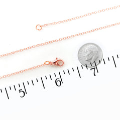Copper chain necklace with lobster clasp and extender, shown on a white background with a coin and ruler for scale.