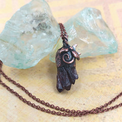 Little Copper Moon & Vines Amethyst Pendant on yellow background with blue glass and chain
