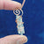 Video showing all aides of three quartz crystals copper wire-wrapped spiral pendant.