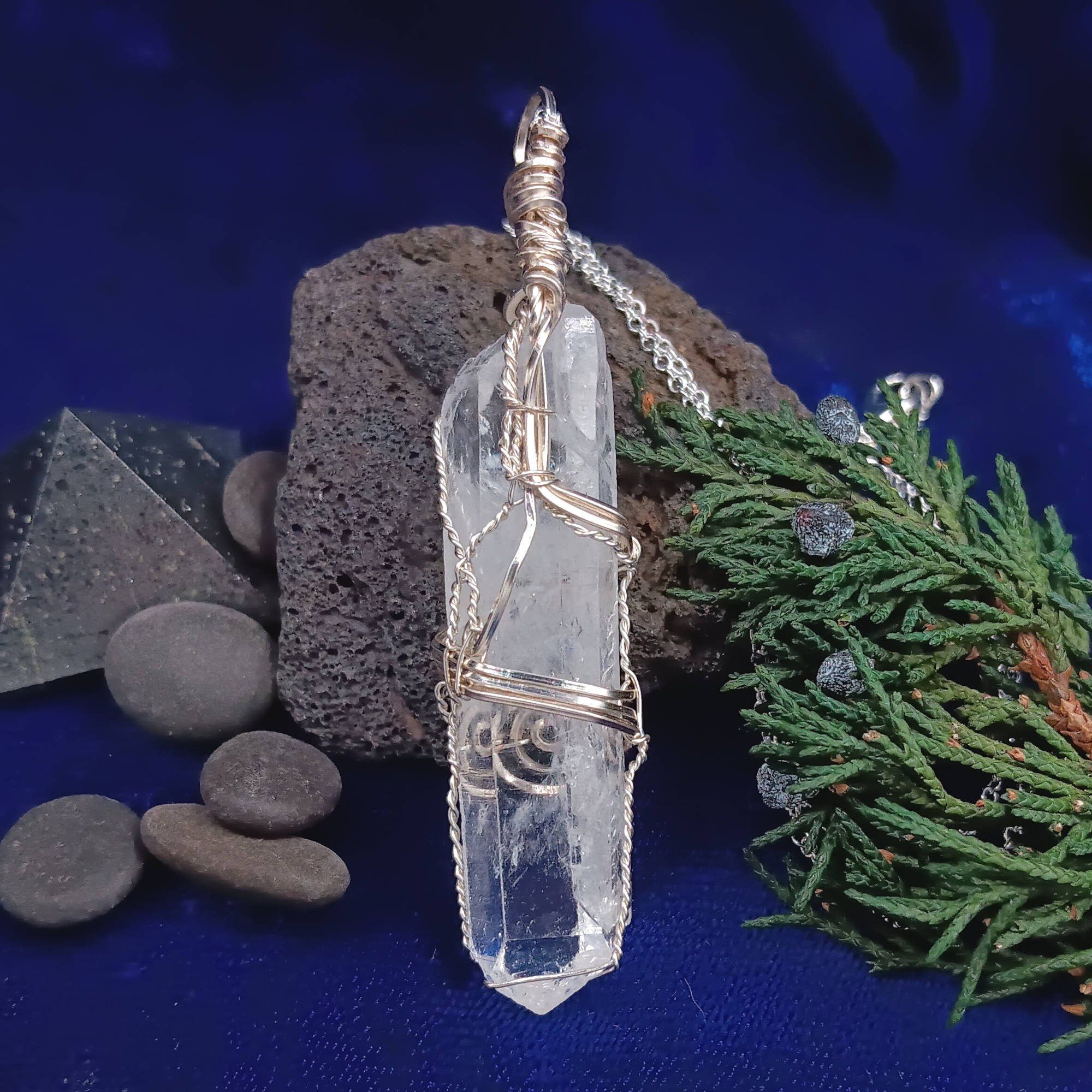 Raw Quartz Crystal Point Pendant – Silver-Plated Wire Wrapped Necklace, backside, with rocks and plants