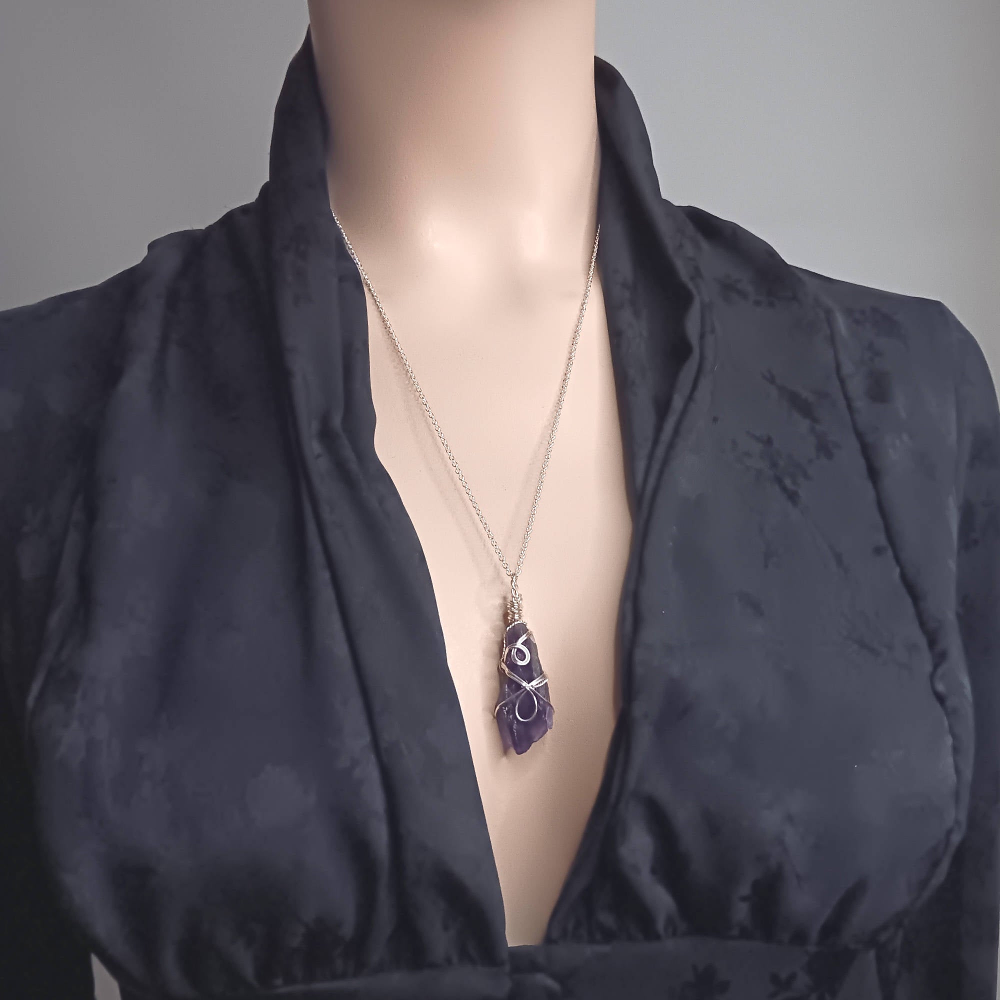 Raw Amethyst Crystal Point Pendant silver wire wrapped, worn by a model