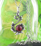 Leafy Vine Pendant w/ Garnet Cabochon Curling Scroll Floral Nature Jewelry Wedding Bridesmaid Gift with chain green background
