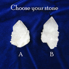 Close up picture of two Spirit Quartz crystals labeled and aligned on dark background.
