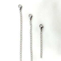 Three stainless steel lobster clasp chain extender straps of varying lengths arranged vertically on a white background.