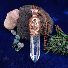 Copper pendant with triple moon and crystal, backside showing eye and triple spiral