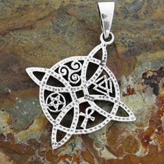 View of backside of a silver witch's knot pendant with four symbols with hammered finish and inscribed 925 on a terra cotta stone background