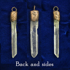 3 views of back, left side and right side of  pendant made of clear quartz point with handmade copper cap  and braided bail on dark blue cloth background.