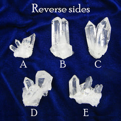 View of the reverse sides of the same 5 clear quartz crystal clusters on a dark background