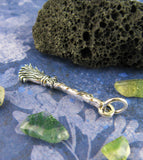 Little Witch's Broom Besom Charm Pendant Wiccan Broomstick Pagan Wicca Witchy Jewelry Goth Gothic Halloween Alternative laying flat with blue background green stones