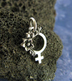 Tiny Feminist Symbol Pendant Charm Necklace Pro Choice Roe v Wade Women's Abortion Rights Jewelry Female Pride Woman Girl Power Feminism in front of lava rock