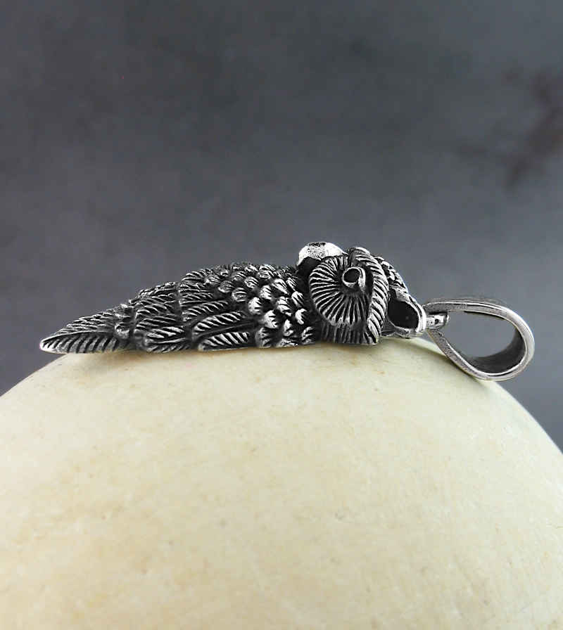 Owl With a Wing Wrapped Around Itself Pendant Side View Profile Head Turned